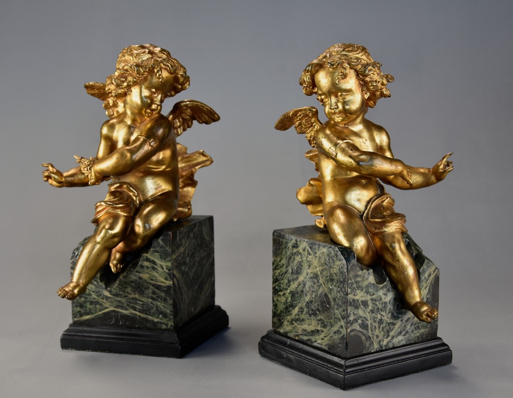Pair of fine quality early 19th century French ormolu winged cherubs supported on faux marble bases View II