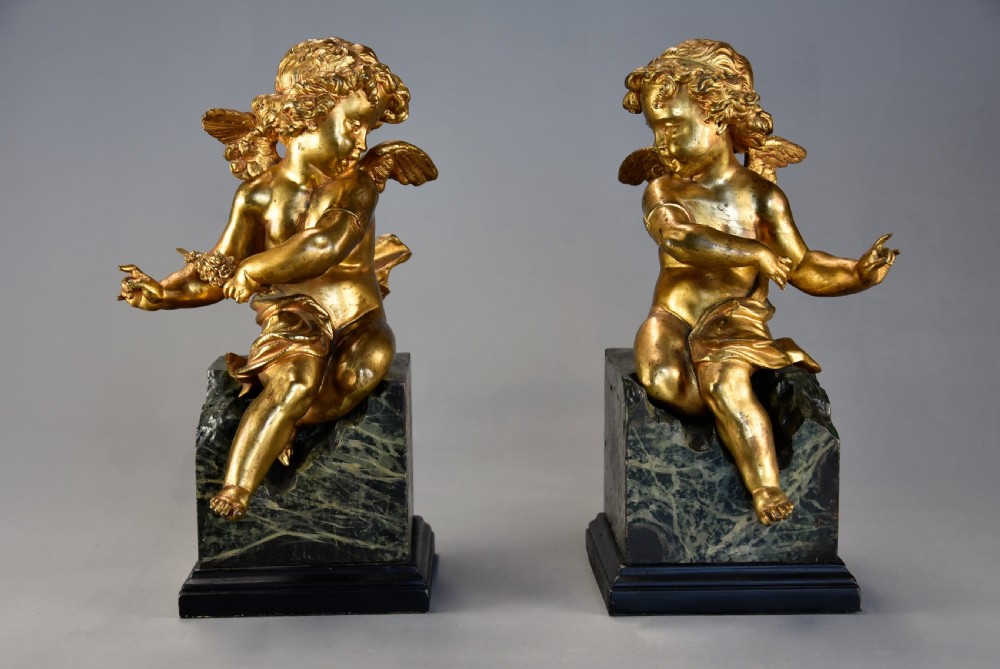 Pair of fine quality early 19th century French ormolu winged cherubs supported on faux marble bases View III