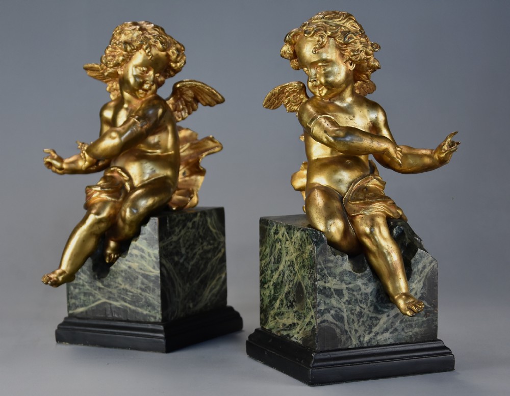 Pair of fine quality early 19th century French ormolu winged cherubs supported on faux marble bases View VI