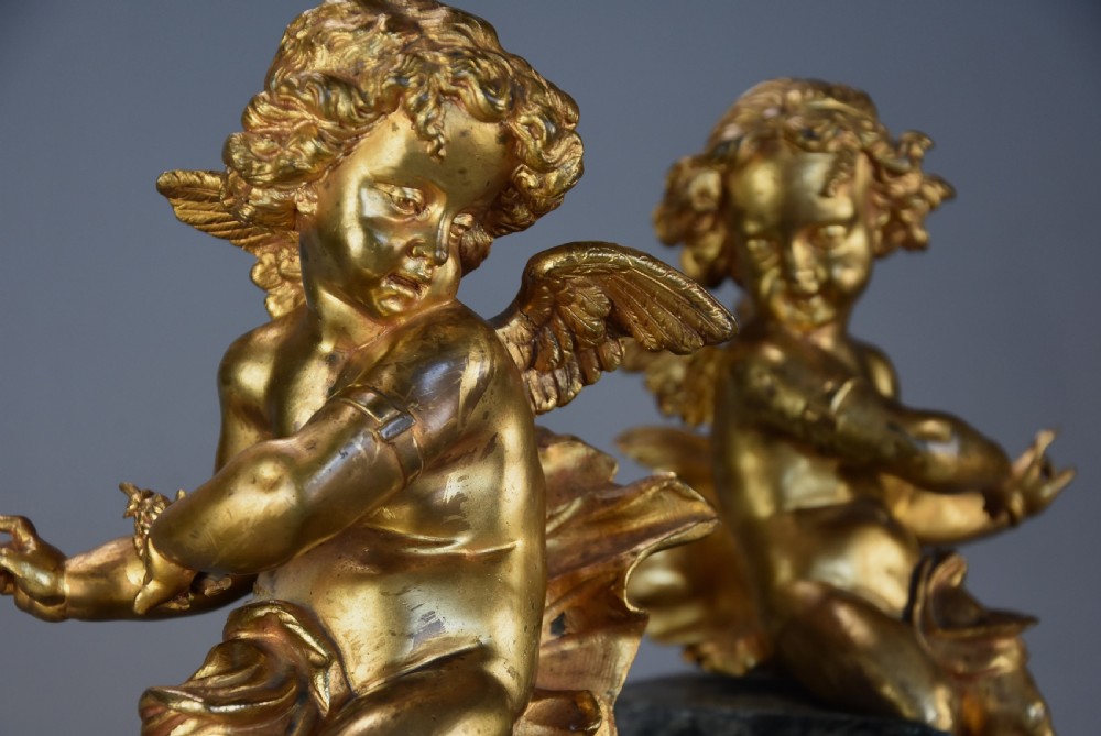 Pair of fine quality early 19th century French ormolu winged cherubs supported on faux marble bases View VIII