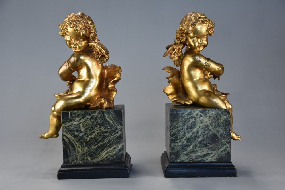 Pair of fine quality early 19th century French ormolu winged cherubs supported on faux marble bases View IX