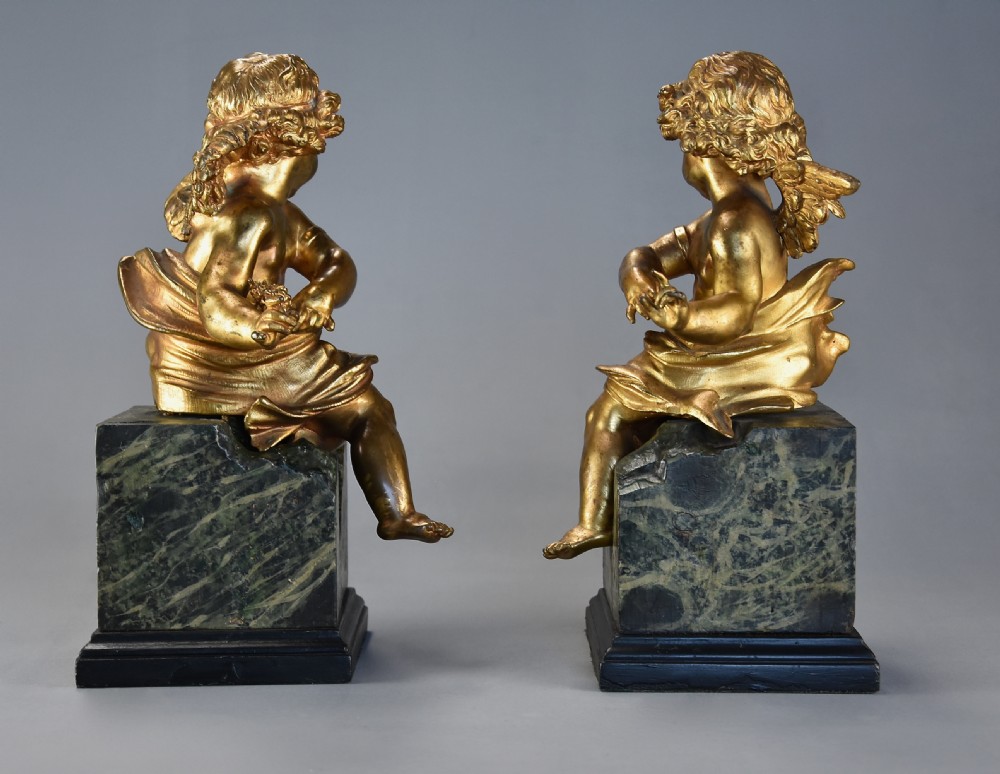 Pair of fine quality early 19th century French ormolu winged cherubs supported on faux marble bases View X
