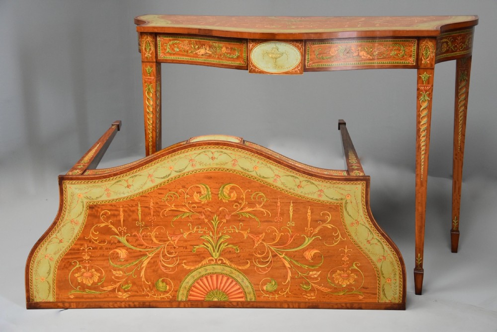 Superb pair of Sheraton revival satinwood & painted serpentine shaped console tables