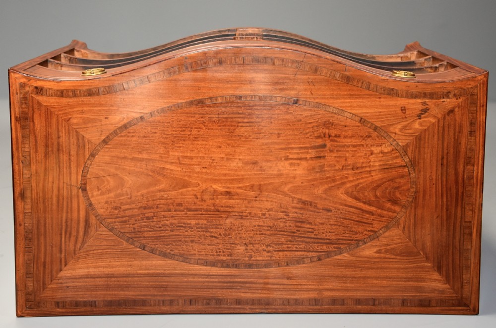 A late eighteenth-century George III serpentine-front satinwood dressing chest featuring four graduated drawers with brass rosette handles. View XIV