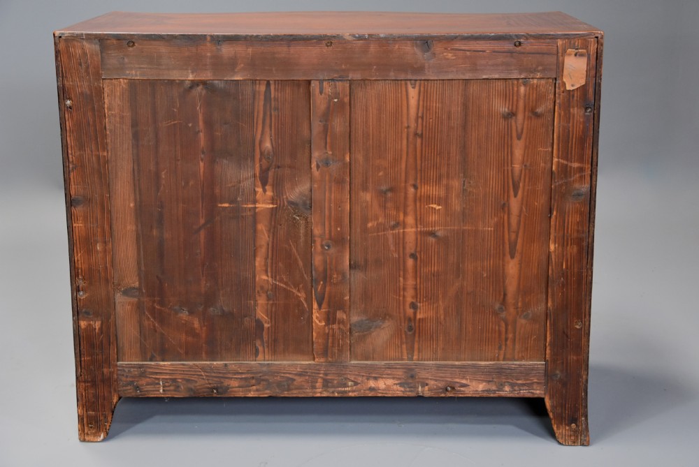 A late eighteenth-century George III serpentine-front satinwood dressing chest featuring four graduated drawers with brass rosette handles. View XVI