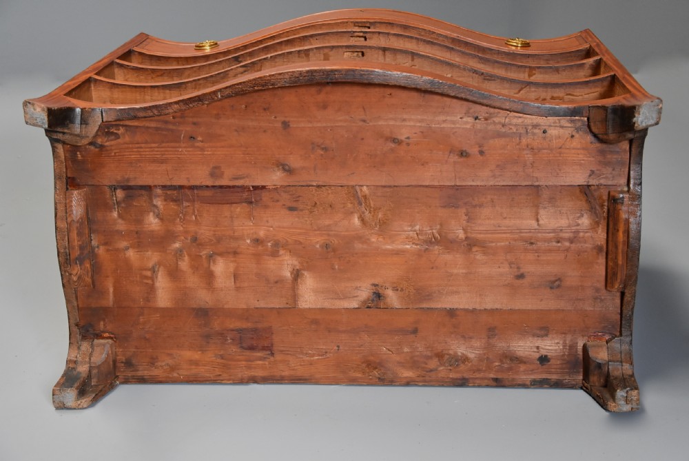 A late eighteenth-century George III serpentine-front satinwood dressing chest featuring four graduated drawers with brass rosette handles. View XVII