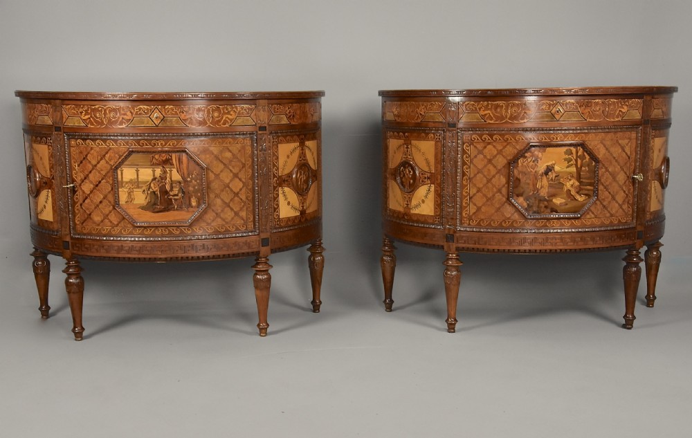 A pair of Italian Neoclassical demi-lune side cabinets featuring intricate floral and figurative marquetry inlay with tapered turned legs. View II