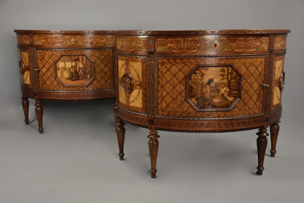 A pair of Italian Neoclassical demi-lune side cabinets featuring intricate floral and figurative marquetry inlay with tapered turned legs. View V