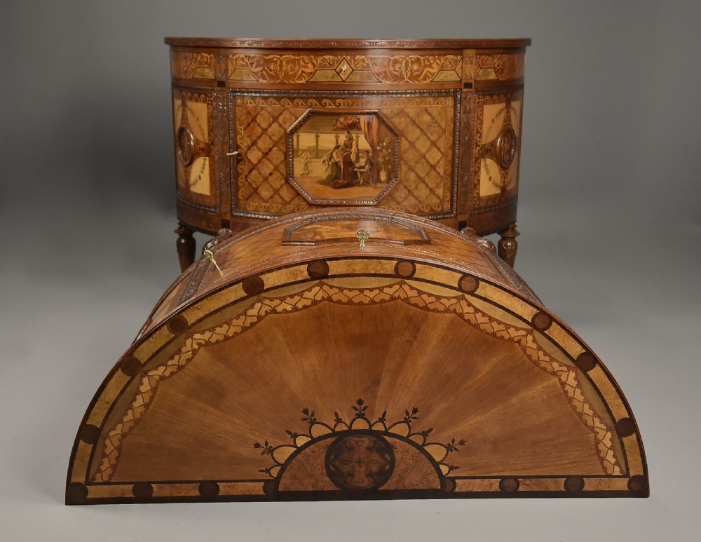 A pair of Italian Neoclassical demi-lune side cabinets featuring intricate floral and figurative marquetry inlay with tapered turned legs. View VI