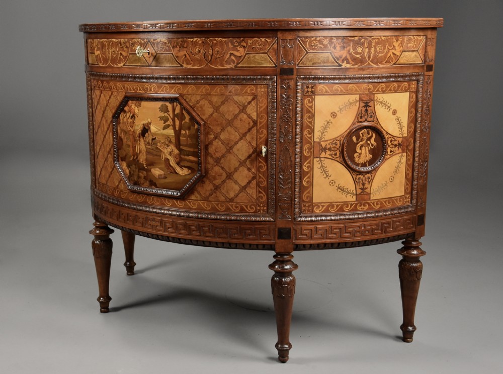A pair of Italian Neoclassical demi-lune side cabinets featuring intricate floral and figurative marquetry inlay with tapered turned legs. View X