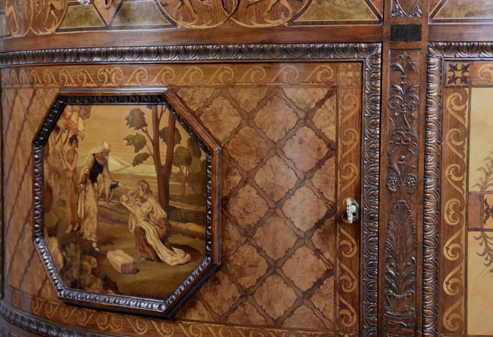 A pair of Italian Neoclassical demi-lune side cabinets featuring intricate floral and figurative marquetry inlay with tapered turned legs. View XIII