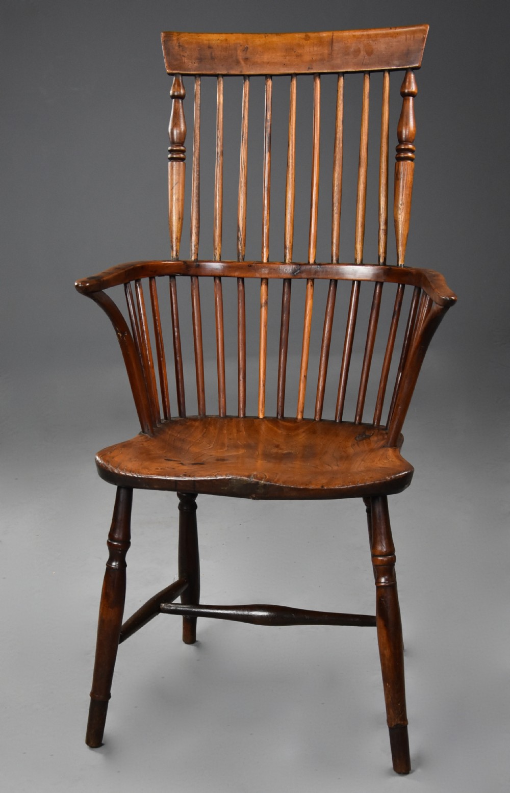 Mid 19th century ash, elm & fruitwood comb back Windsor armchair of wonderful patina 