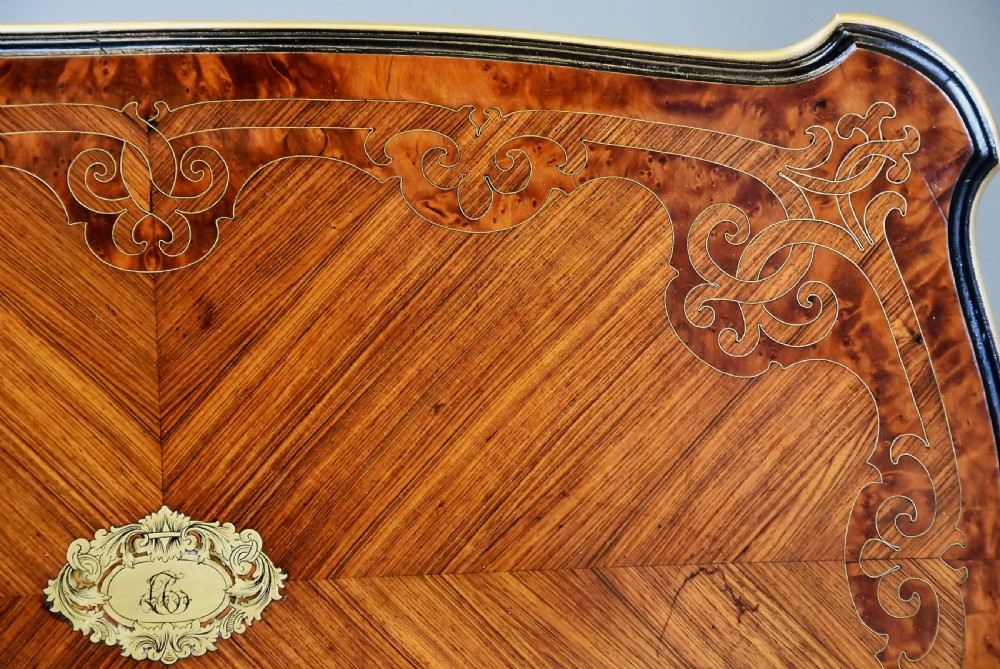A 19th-century French kingwood occasional table featuring serpentine sides, parquetry veneer top, floral inlay, ormolu mounts, frieze drawer, and cabriole legs. View XI
