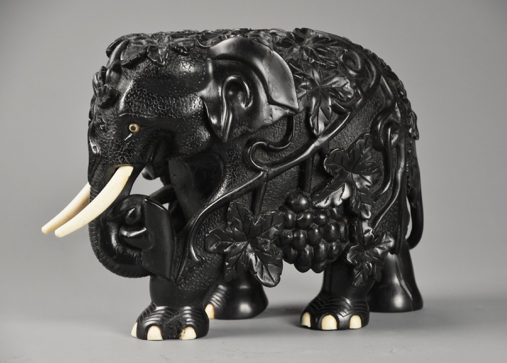 Rare mid 19th century finely carved Ceylonese ebony elephant from the Galle district of Sri Lanka (formerly Ceylon) View VI