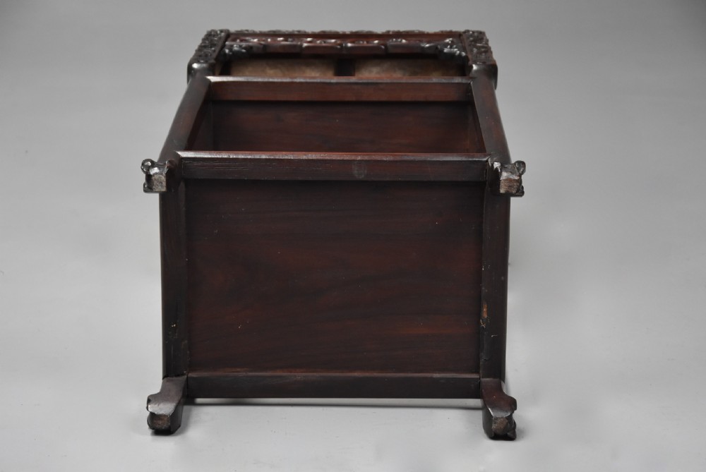 A late 19th-century rectangular Chinese dark hardwood pot stand featuring a pink marble insert top, pierced openwork aprons, and two lower tiers. View IX