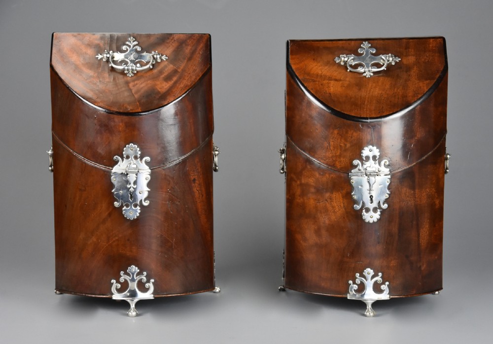 A pair of late eighteenth-century bow-front mahogany cutlery boxes with silver mounts and claw feet. View III