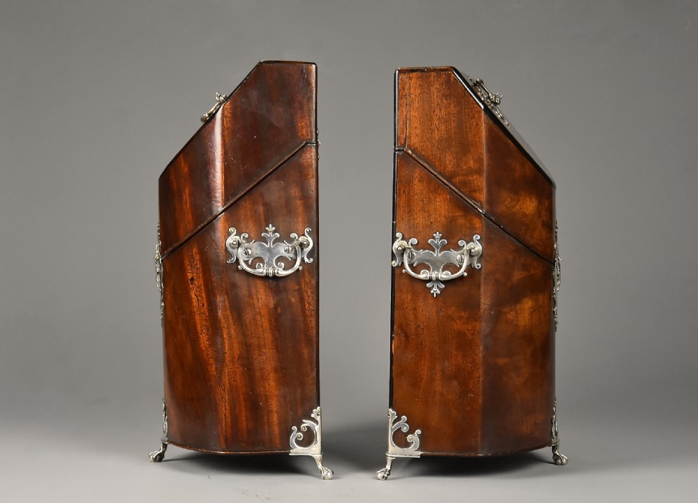 A pair of late eighteenth-century bow-front mahogany cutlery boxes with silver mounts and claw feet. View XI