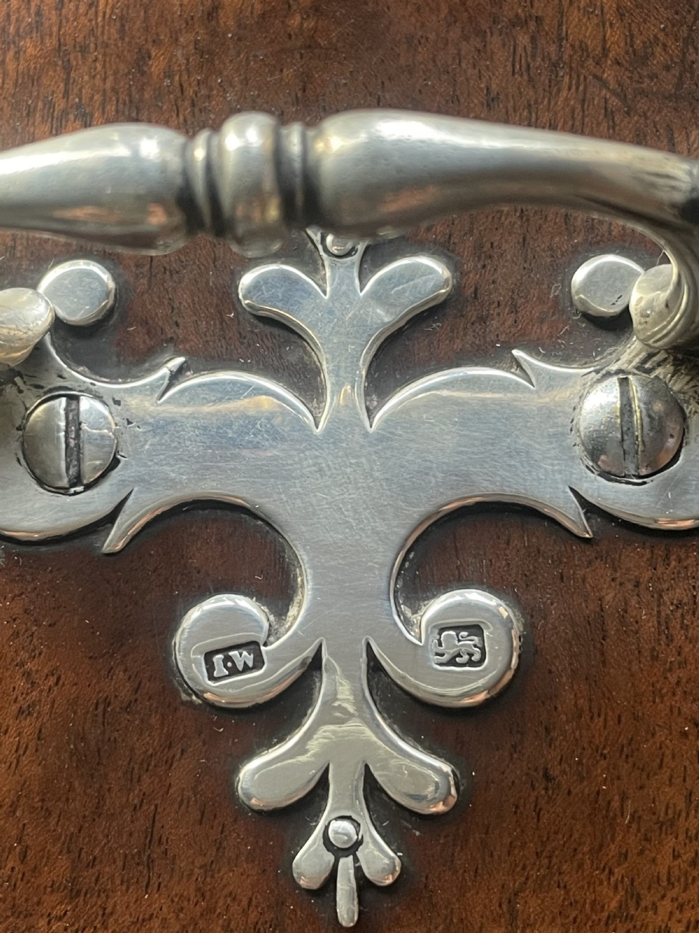 A pair of late eighteenth-century bow-front mahogany cutlery boxes with silver mounts and claw feet. View XIII