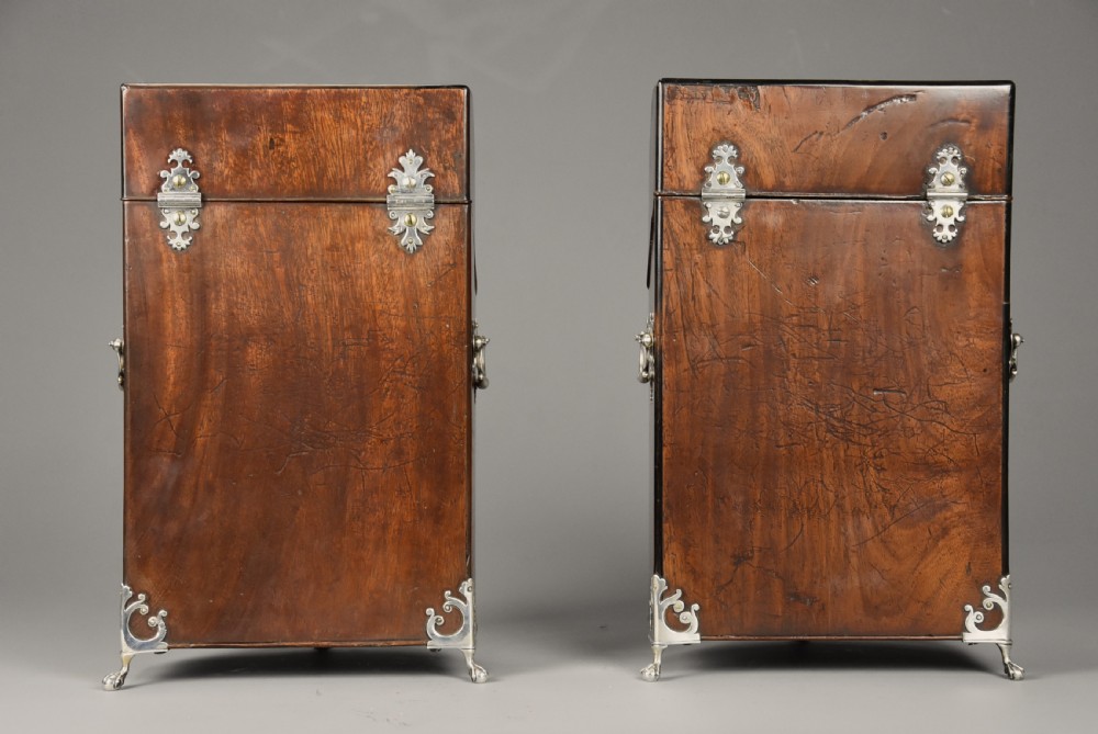A pair of late eighteenth-century bow-front mahogany cutlery boxes with silver mounts and claw feet. View XV