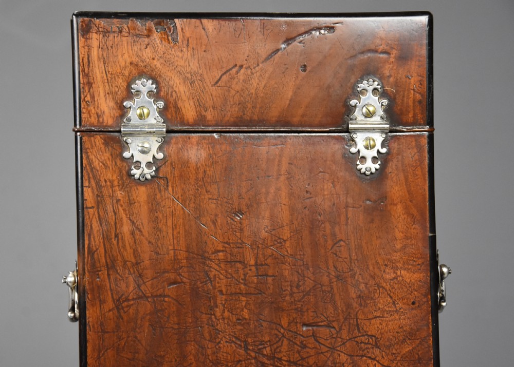 A pair of late eighteenth-century bow-front mahogany cutlery boxes with silver mounts and claw feet. View XVI