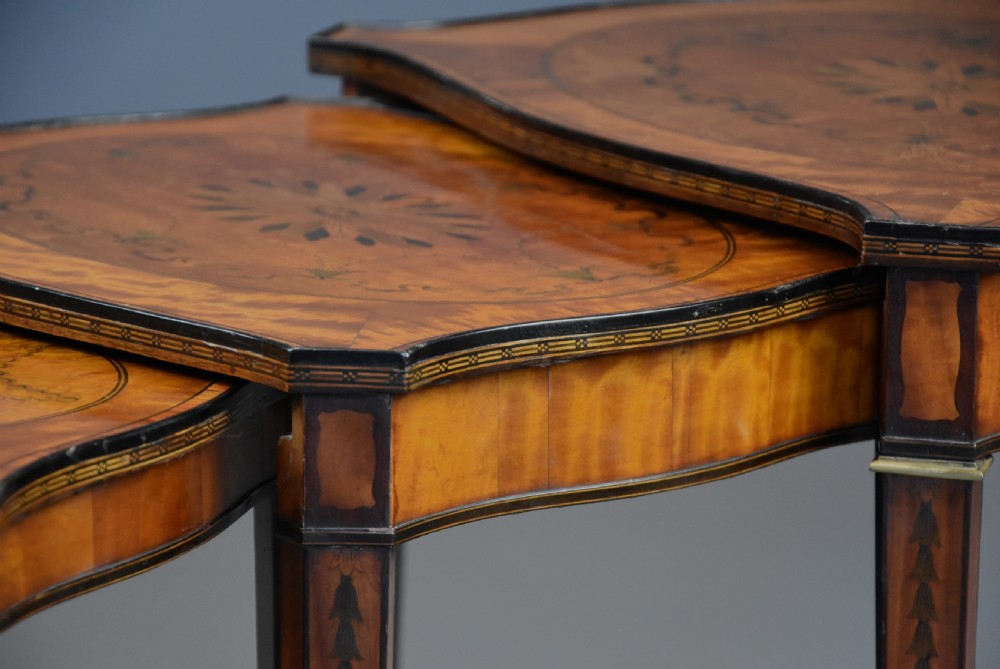 A set of four Edwardian Sheraton style nested tables crafted from inlaid wood with serpentine tops and tapered legs. View VII