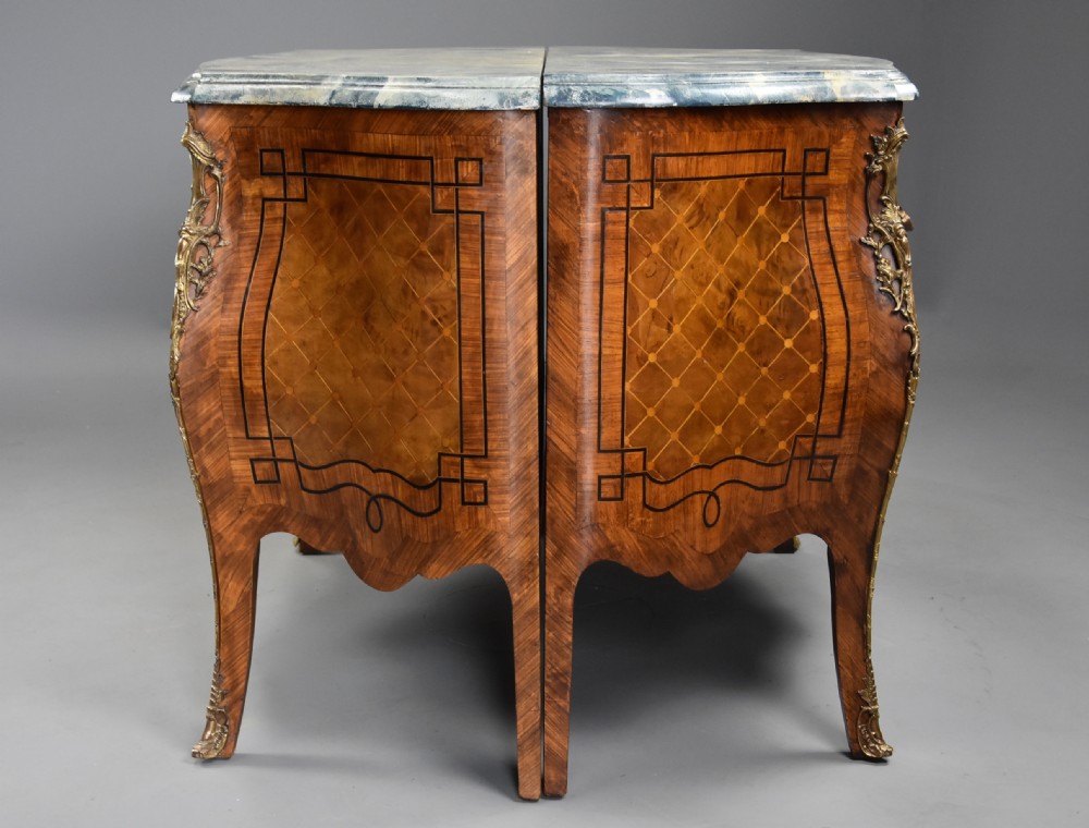 A pair of early 20th century French kingwood bombe commodes with floral marquetry inlay, gilt-bronze mounts, and marble tops. View XIII
