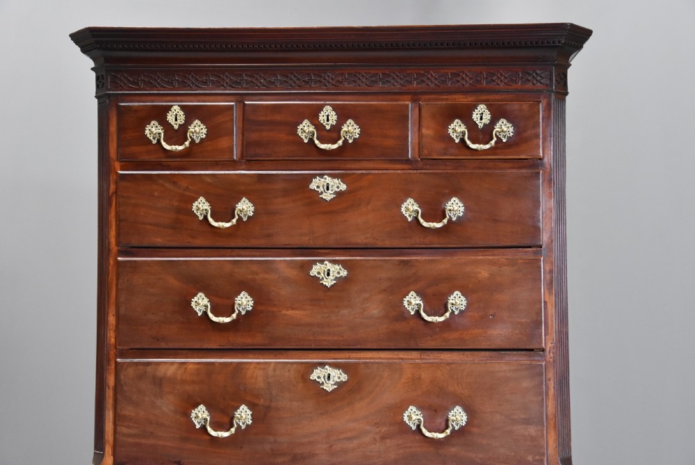 A mid-18th-century Georgian mahogany chest on chest featuring brass swan-neck handles, fluted chamfered corners, and ogee bracket feet. View IV