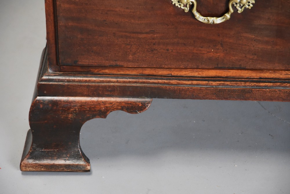A mid-18th-century Georgian mahogany chest on chest featuring brass swan-neck handles, fluted chamfered corners, and ogee bracket feet. View VIII
