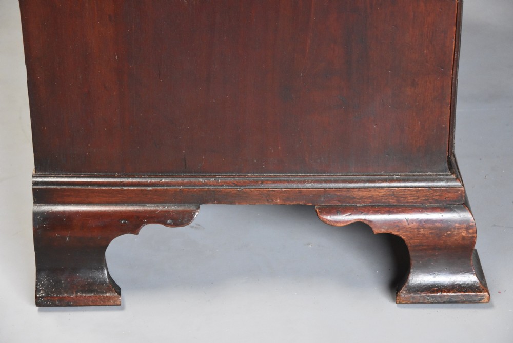 A mid-18th-century Georgian mahogany chest on chest featuring brass swan-neck handles, fluted chamfered corners, and ogee bracket feet. View XI