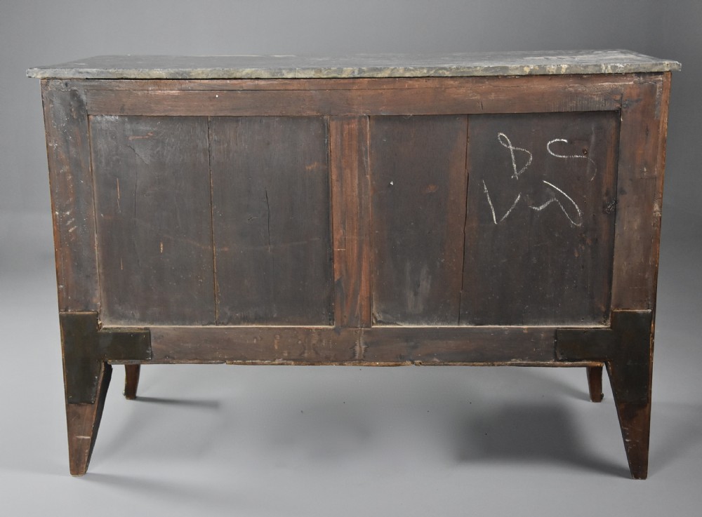 A late nineteenth-century French Louis XVI style tulipwood breakfront commode featuring inlaid parquetry panels, ring-pull brass handles, and a fitted grey marble top. View XV