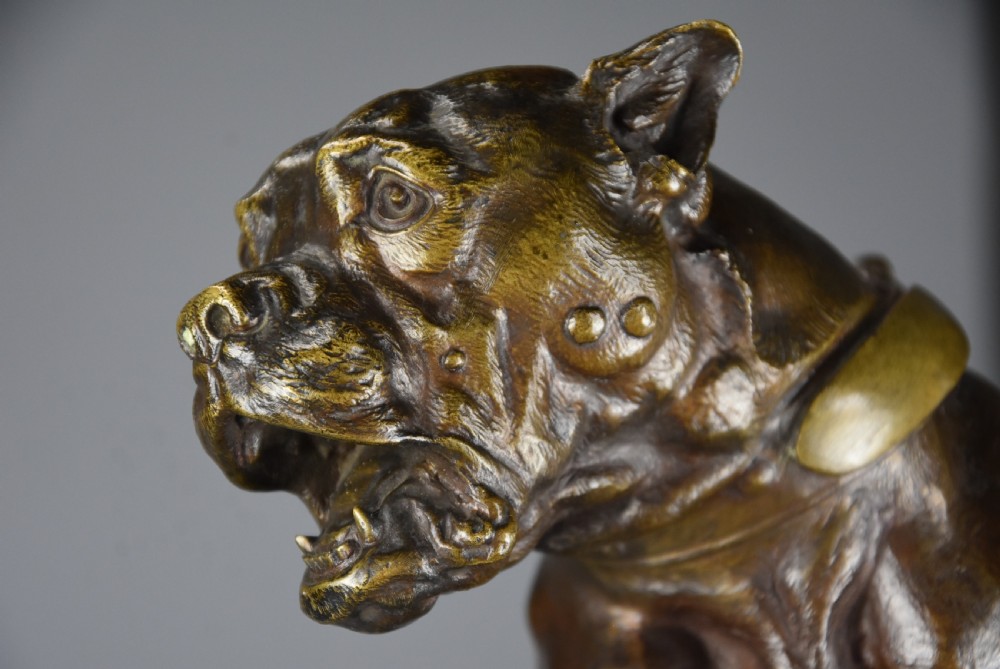A 19th-century dark bronze sculpture of a chained guard dog rearing against a post, mounted on a brass collar and red veined marble base. View XVII
