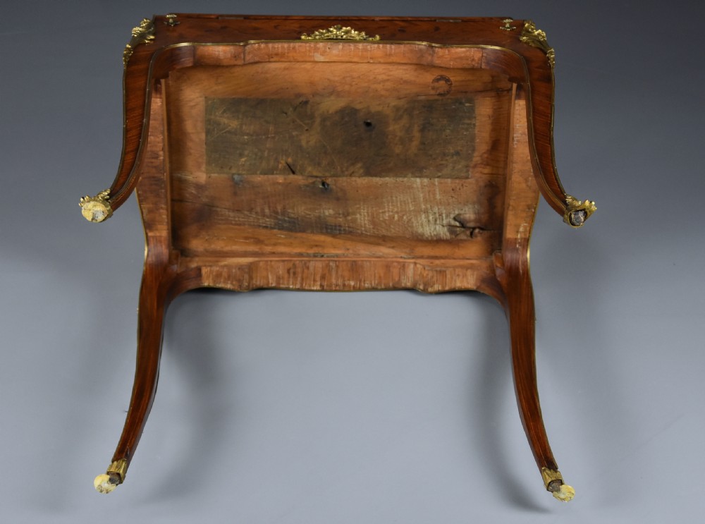 A French Louis XV style petite secretaire en pente with intricate floral marquetry veneers, gilt-bronze mounts, and cabriole legs. View XVI