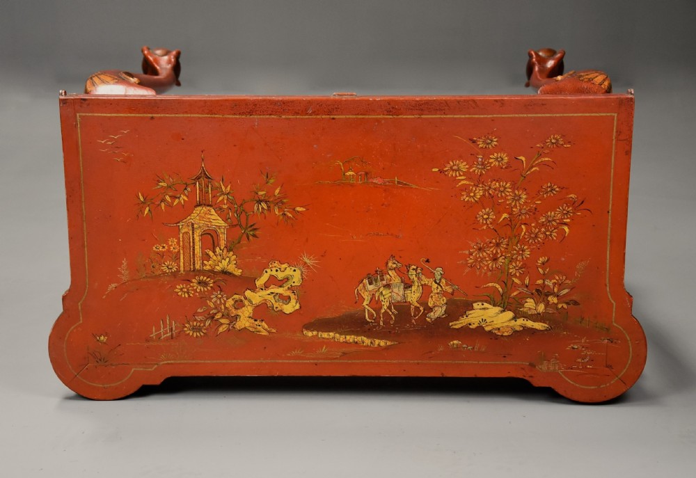 An early twentieth-century red lacquered games table with gilded Chinoiserie designs, cabriole legs, and ball and claw feet. View IX