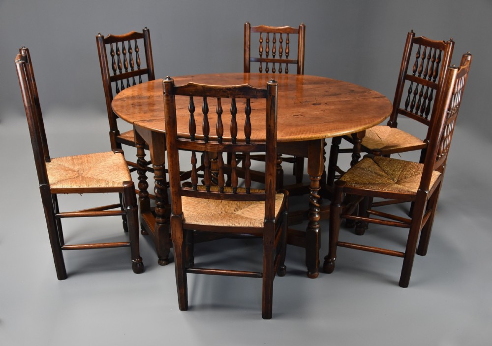 A 17th-century walnut gateleg table with extended oval drop leaves and double barley twist turned legs supported by stretchers. View XIII