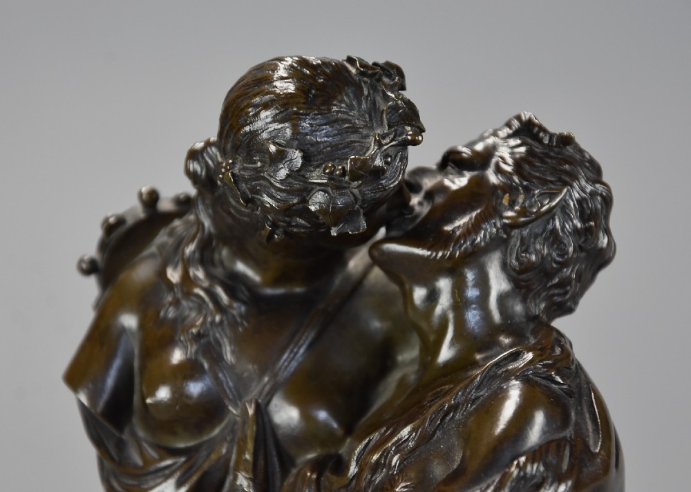A pair of 19th-century patinated bronze miniature busts of kissing figures, mounted on cylindrical grey marble bases with gilt bronze mounts. View VII
