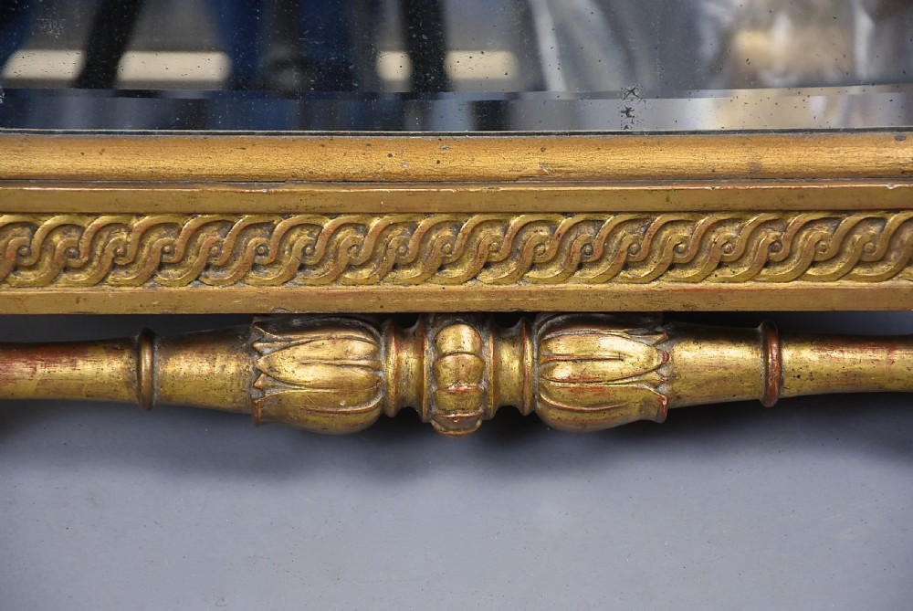 A late nineteenth-century Renaissance Revival carved giltwood table mirror featuring a scrolled cresting, guilloche moulding, and paw feet. View X