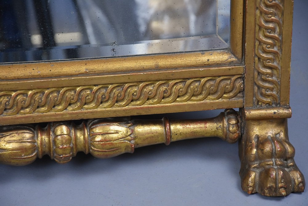 A late nineteenth-century Renaissance Revival carved giltwood table mirror featuring a scrolled cresting, guilloche moulding, and paw feet. View XI