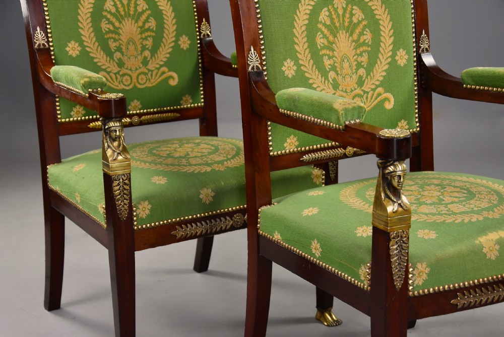 Pair of late 19th-century French Empire style mahogany open armchairs upholstered in green patterned fabric with brass mounts and paw feet. View VI