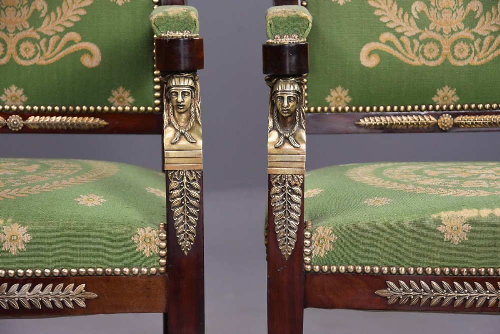 Pair of late 19th-century French Empire style mahogany open armchairs upholstered in green patterned fabric with brass mounts and paw feet. View VII
