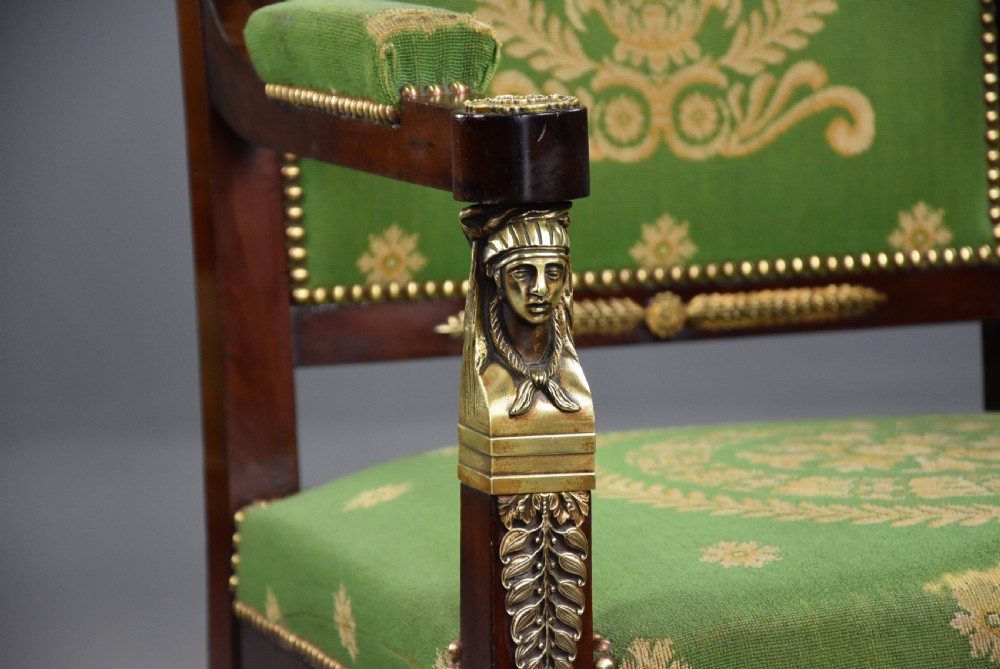Pair of late 19th-century French Empire style mahogany open armchairs upholstered in green patterned fabric with brass mounts and paw feet. View VIII