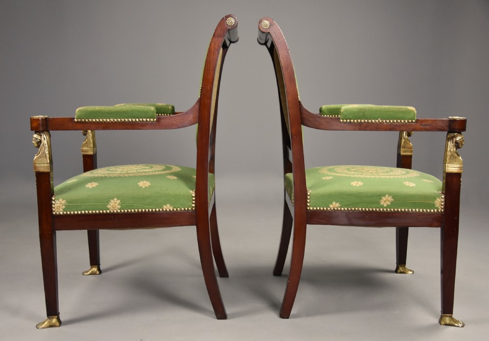 Pair of late 19th-century French Empire style mahogany open armchairs upholstered in green patterned fabric with brass mounts and paw feet. View XII