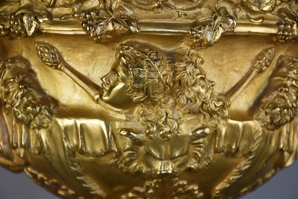 A 19th-century gilt bronze reduction of the Warwick Vase featuring high-relief Bacchic masks, intertwined vine handles, and a pedestal base. View IX