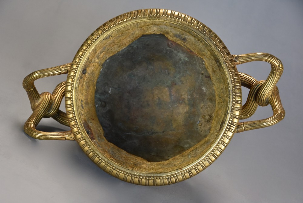A 19th-century gilt bronze reduction of the Warwick Vase featuring high-relief Bacchic masks, intertwined vine handles, and a pedestal base. View XIII