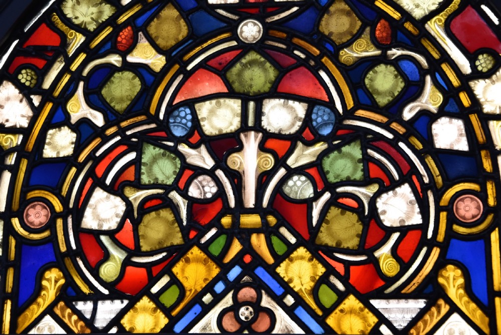 A vertical three-part Victorian Gothic Revival stained glass panel depicting the Ascension of Christ with detailed painted leaded features. View VI