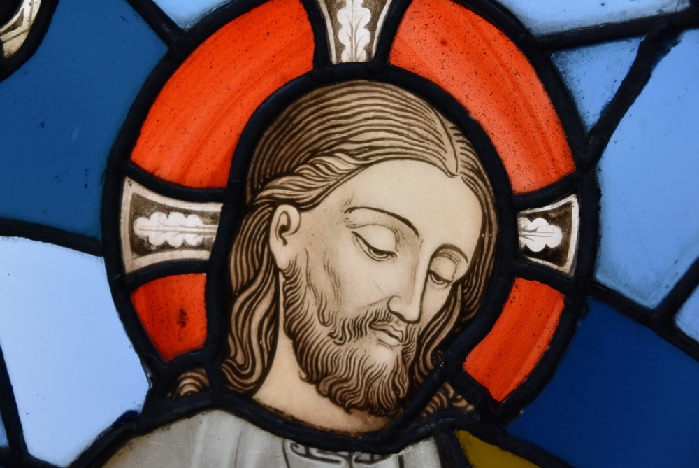 A vertical three-part Victorian Gothic Revival stained glass panel depicting the Ascension of Christ with detailed painted leaded features. View IX
