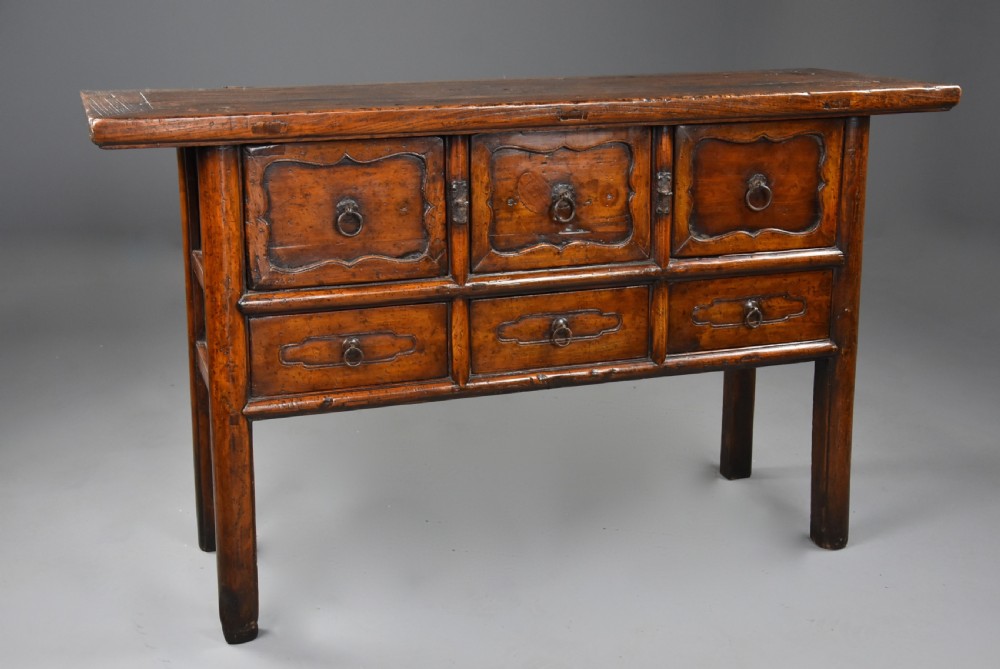 A late nineteenth-century rustic Chinese elm sideboard featuring three upper doors with contoured panels and three lower drawers fitted with metal ring pulls. View VIII