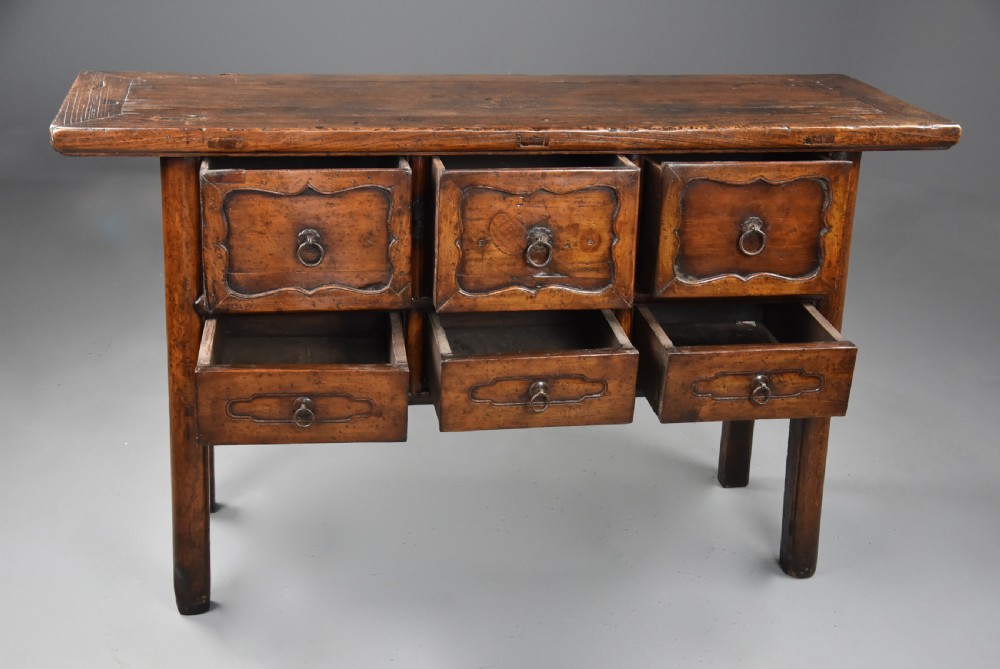 A late nineteenth-century rustic Chinese elm sideboard featuring three upper doors with contoured panels and three lower drawers fitted with metal ring pulls. View IX