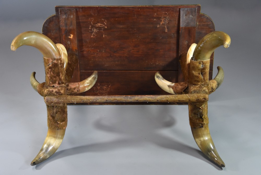 Late nineteenth-century German side table featuring a dark green leather studded top supported by fur-wrapped posts and natural cow horn legs. View IX