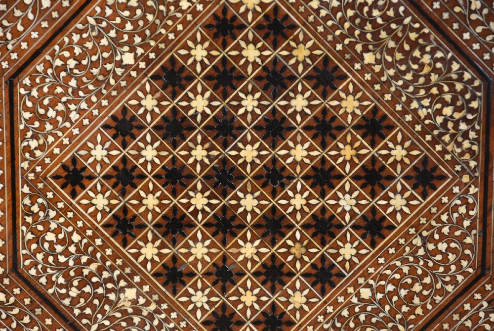 Late 19th-century octagonal Anglo-Indian occasional table crafted from dark wood with extensive geometric bone inlay, a chessboard top design, and arched legs. View IX