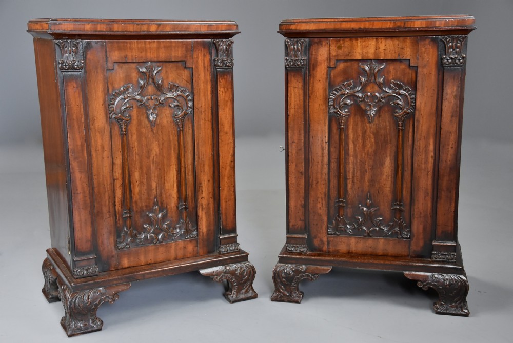 A pair of mid-18th-century mahogany Chippendale pedestal cabinets featuring relief-carved Rococo door panels, corner pilasters, and carved bracket feet. View III